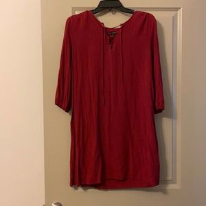 Burgundy three quarter length top.